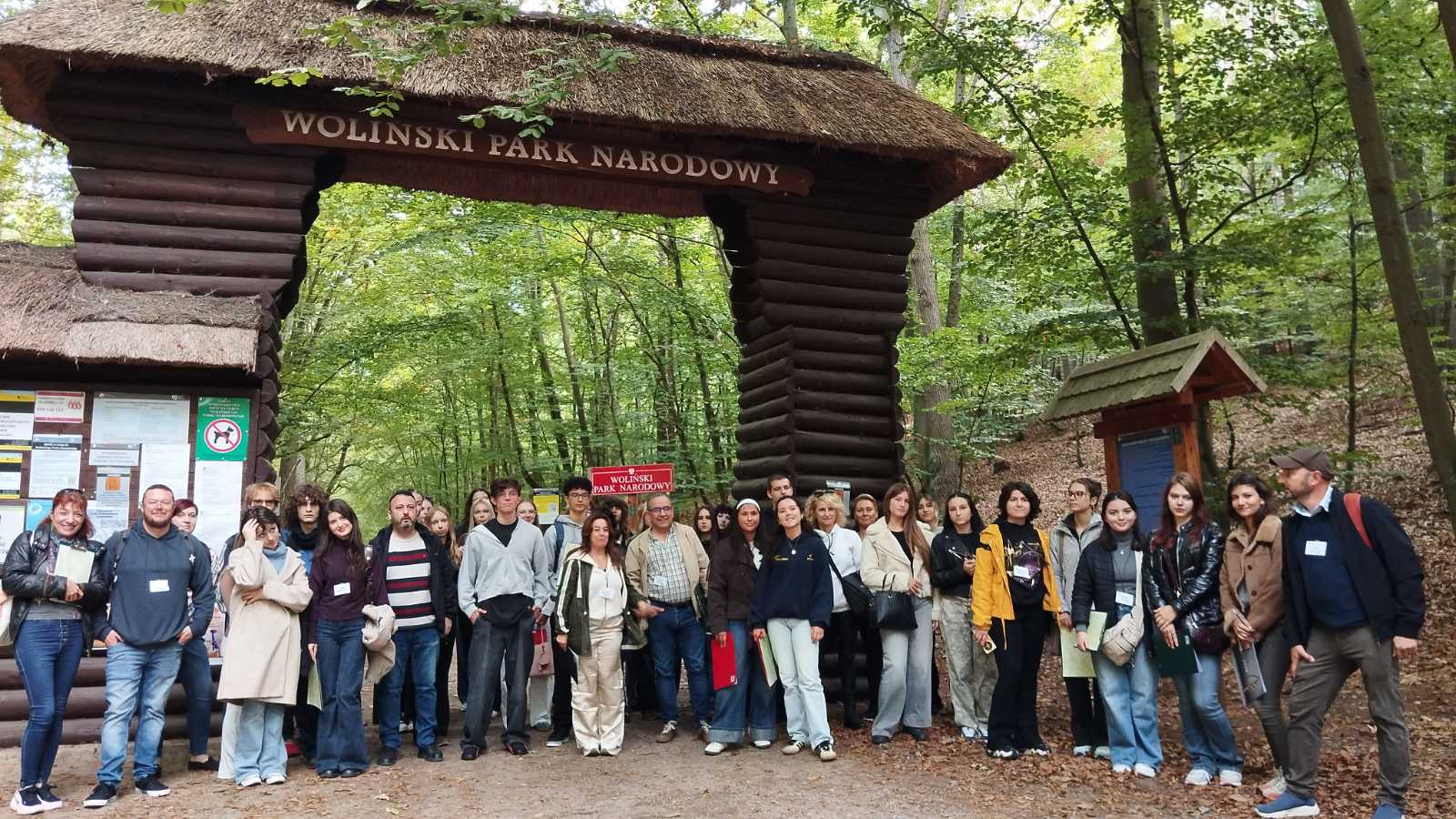 Group of ARTisGReen students and teachers from six countries standing together in Wolin National Park, Poland.